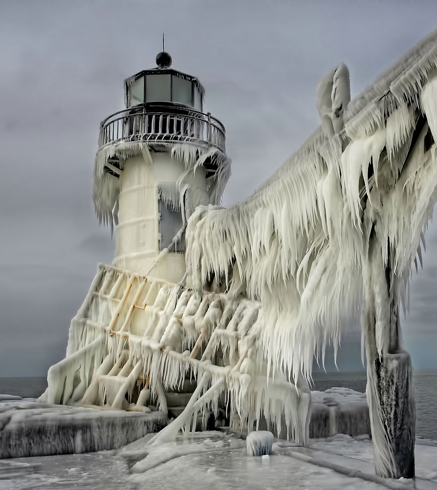 Frozen Lighthouse On Lake Michigan Shore
